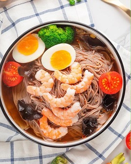 A balanced bowl of noodles, egg, shrimp and vegetables